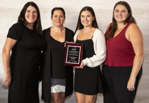 Team accepting the 2025 CAM-X Award of Distinction